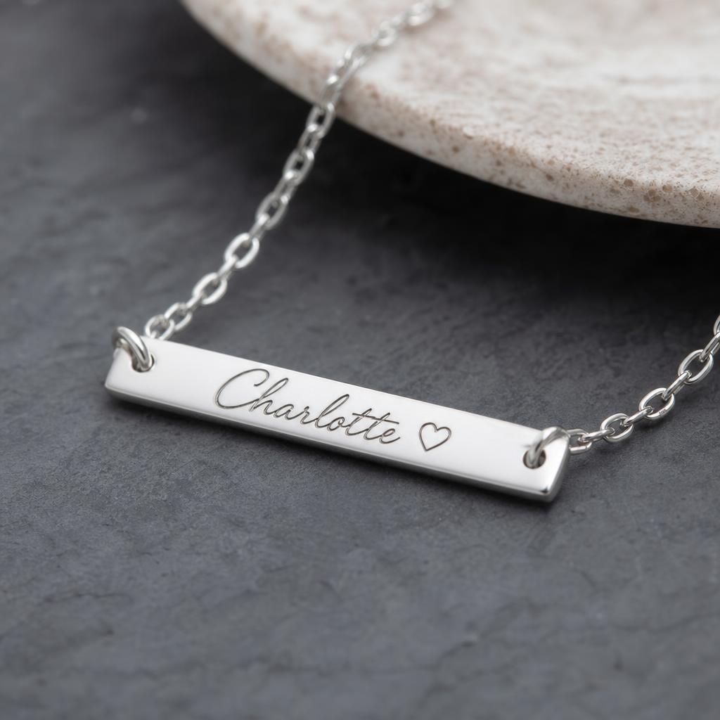 Engraving process of adding initials to a silver pendant